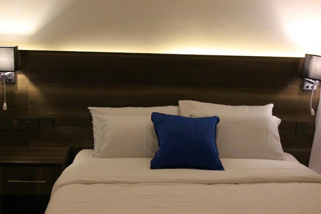 Postel nebo postele na pokoji v ubytování Lukenya Alkebu Resort