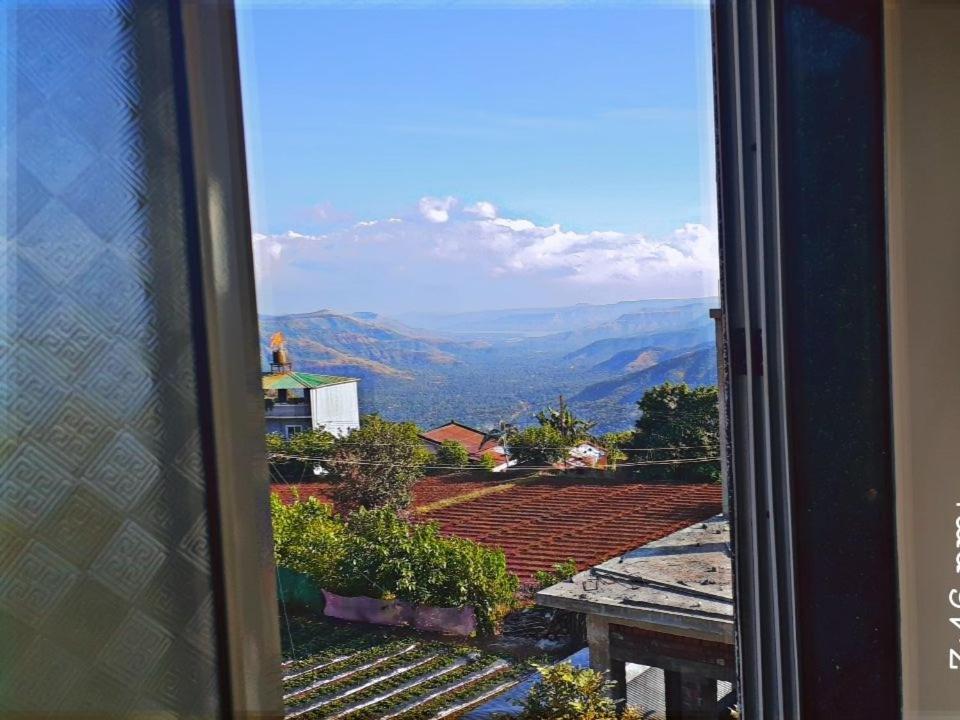 a view from a window of a mountain view at Shinde Niwas Mahableshwar in Mahabaleshwar