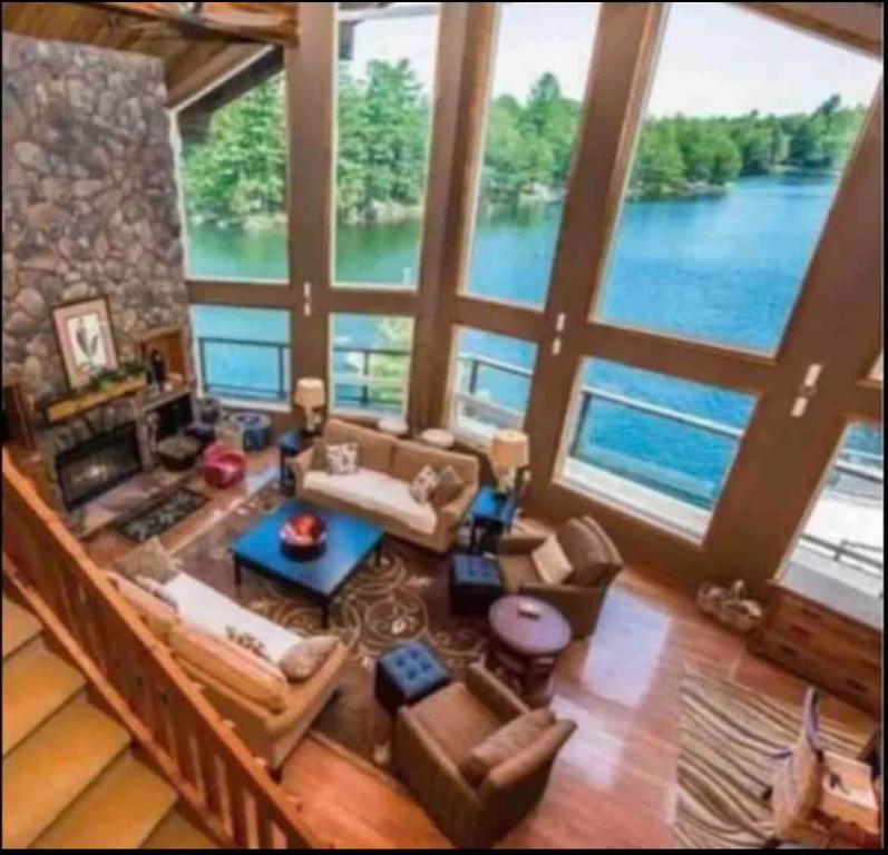 an aerial view of a living room with a large window at WATERFRONT LUXURY HOUSE/CHALET in Ragged Rapids