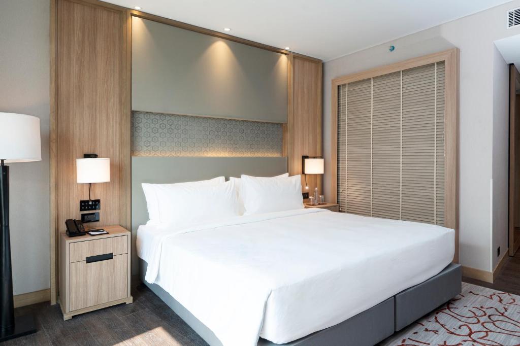Postel nebo postele na pokoji v ubytování LYFE HOTEL