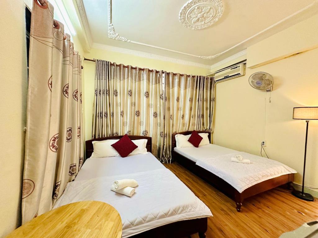 Postel nebo postele na pokoji v ubytování Thanh Huyền Hotel Vũng Tàu