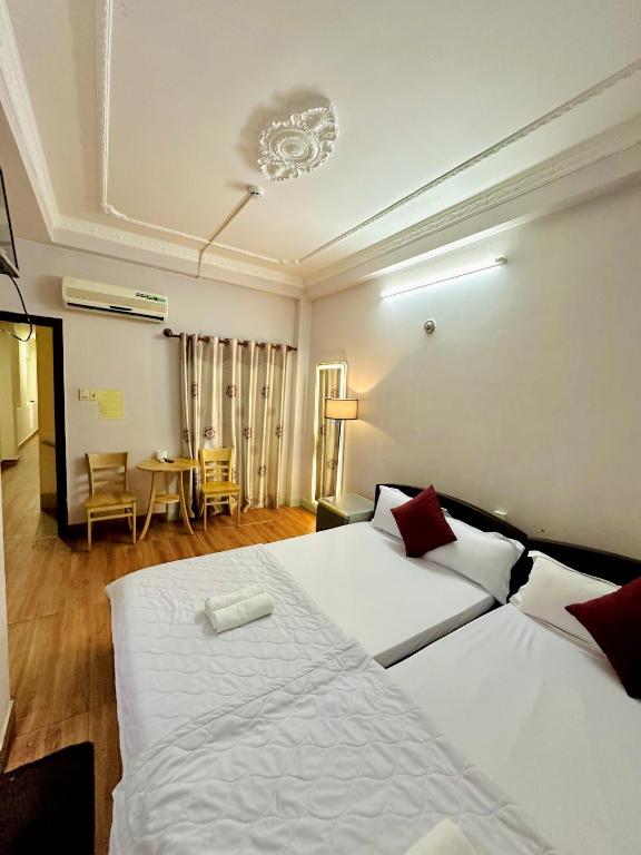 Postel nebo postele na pokoji v ubytování Thanh Huyền Hotel Vũng Tàu