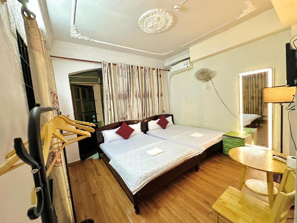 Postel nebo postele na pokoji v ubytování Thanh Huyền Hotel Vũng Tàu