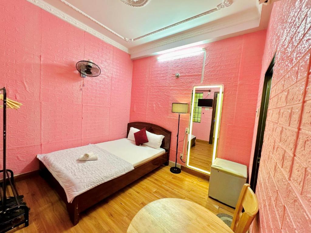 Postel nebo postele na pokoji v ubytování Thanh Huyền Hotel Vũng Tàu