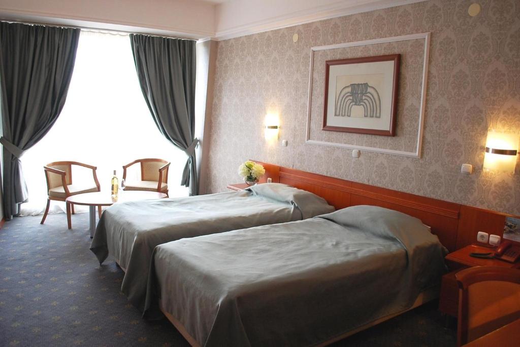 Postel nebo postele na pokoji v ubytování Hotel Drim & SPA
