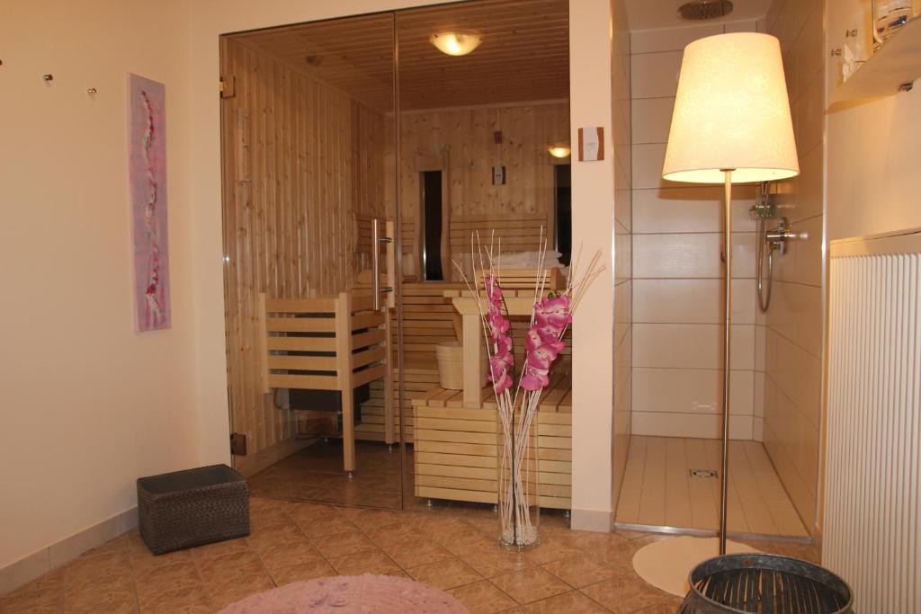 a hallway with a vase of flowers in a room at Wohlfühlpension Kreischberg in Sankt Georgen ob Murau