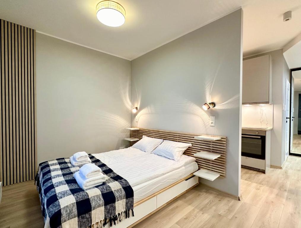 Posteľ alebo postele v izbe v ubytovaní Apartamenty Portova Q4Apartments