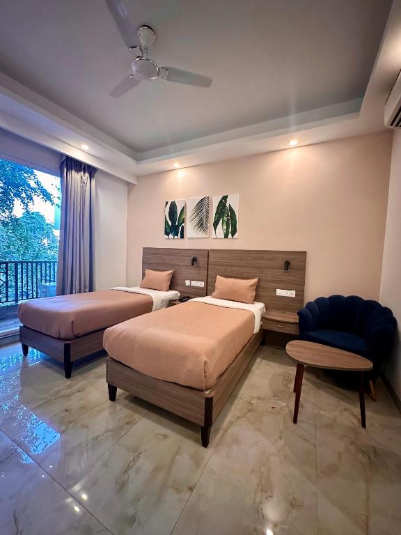 Postel nebo postele na pokoji v ubytování Flock Hotel I Golf Course Road Near Dlf Phase 1 Metro station I Gurugram