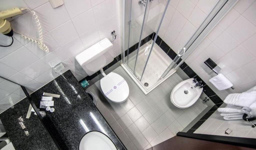 Koupelna v ubytování Hotel Concorde