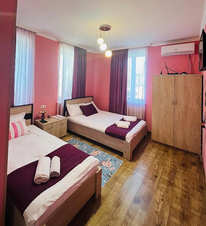 Postel nebo postele na pokoji v ubytování Guest House Lotus