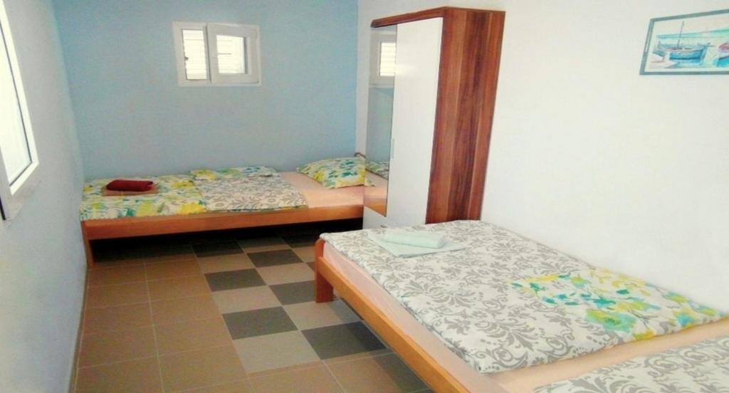 Posteľ alebo postele v izbe v ubytovaní Vis Mirja Apartment 1