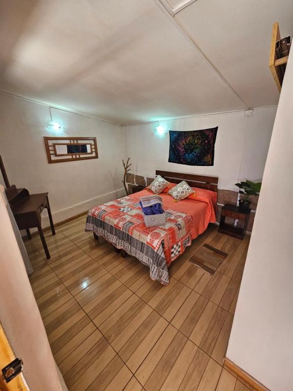Postel nebo postele na pokoji v ubytování Hostal Likancabur