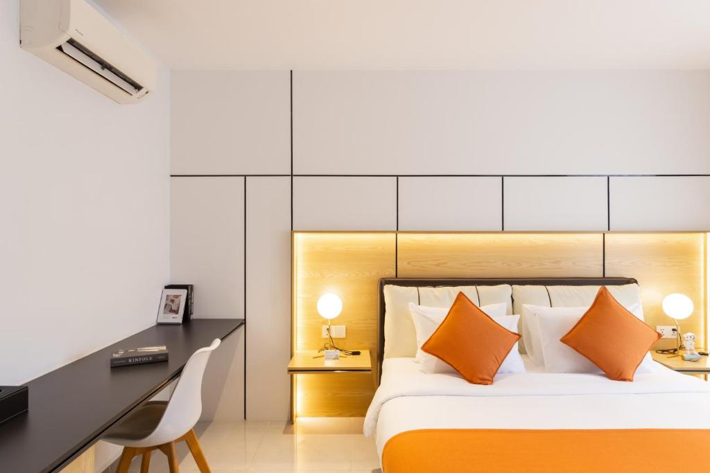 Postel nebo postele na pokoji v ubytování CDX RESIDENCE