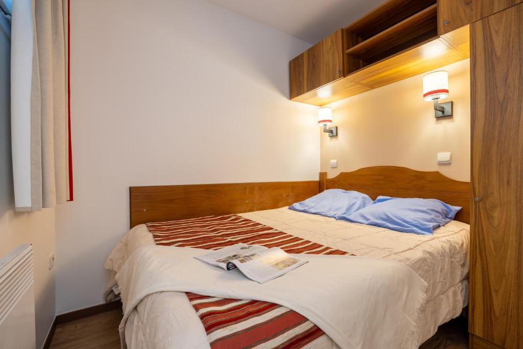 Postel nebo postele na pokoji v ubytování Résidence Pierre & Vacances Les Trois Domaines