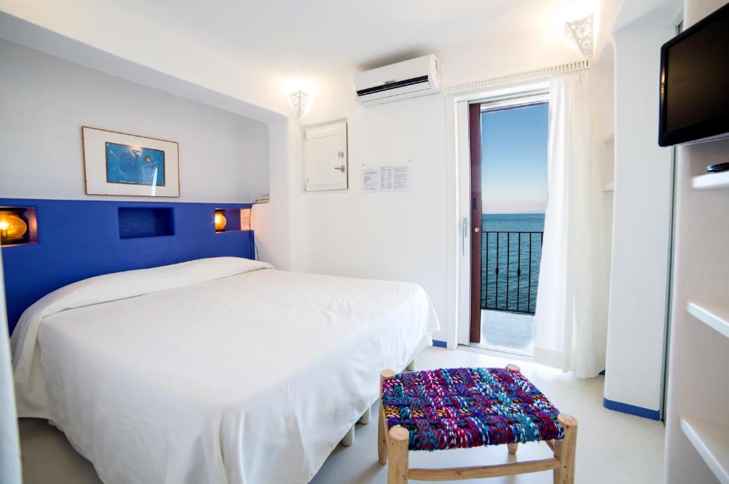 Postel nebo postele na pokoji v ubytování Hotel Saraceno
