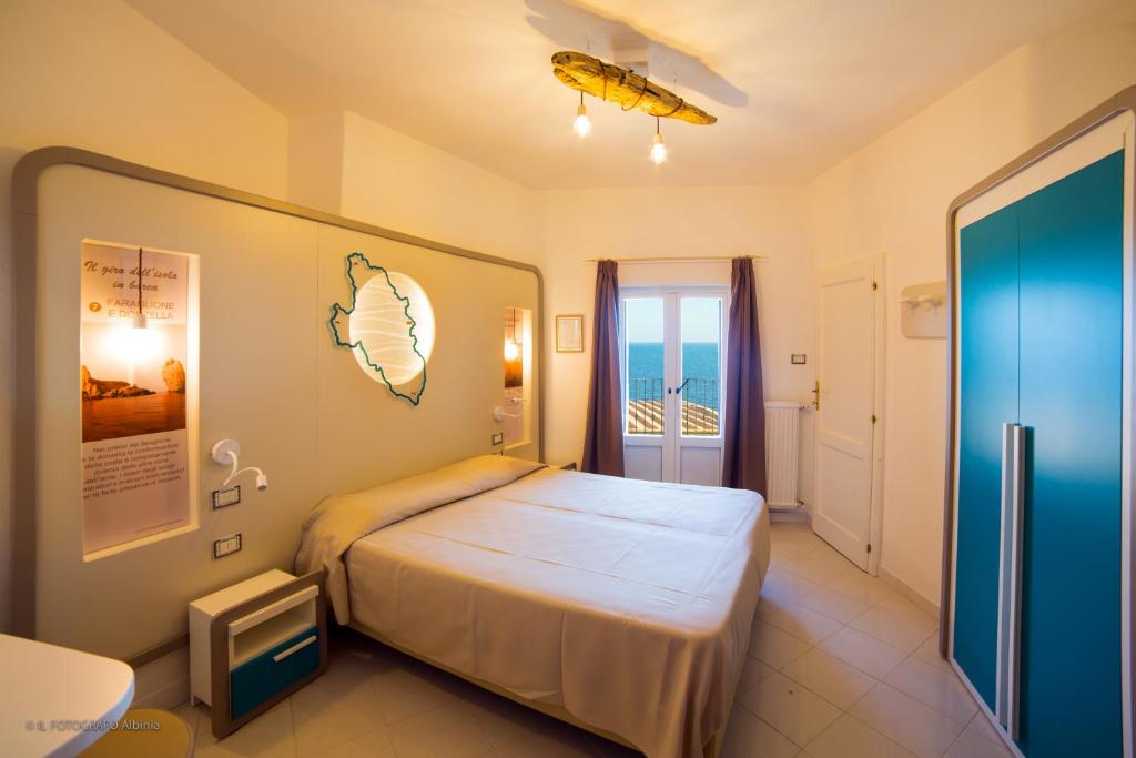 Postel nebo postele na pokoji v ubytování Hotel Saraceno