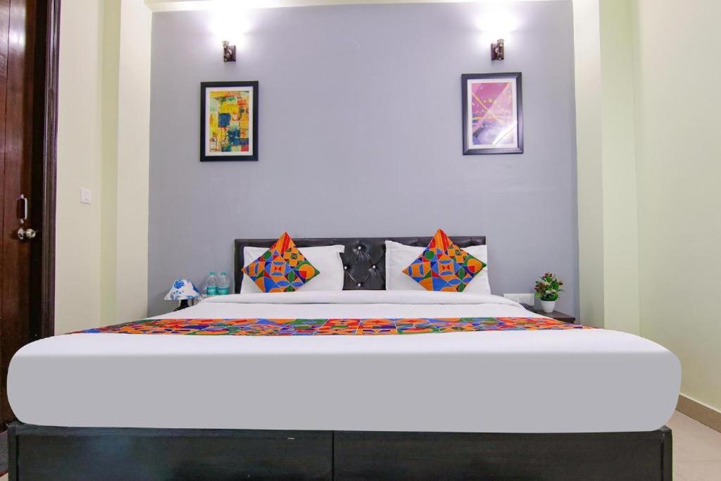 a bedroom with a large bed in a room at Aruba Suites in Noida
