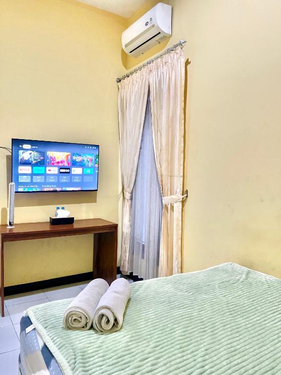 TV a/nebo společenská místnost v ubytování Telu Telu Solo