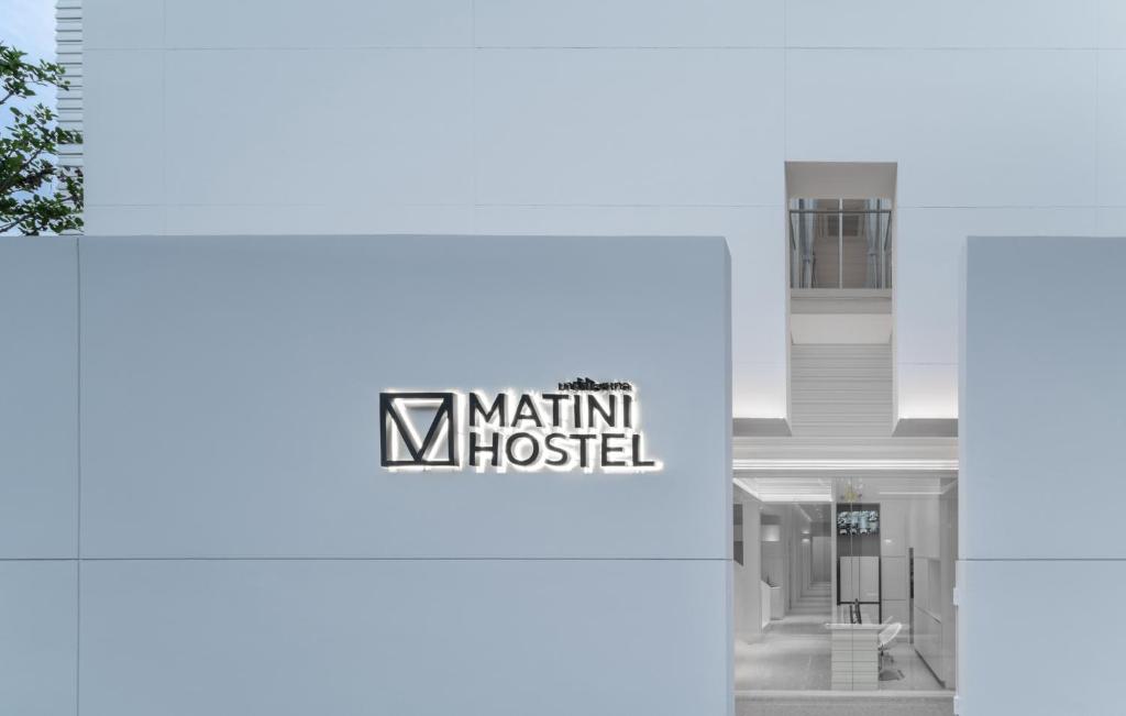 a rendering of a building with the kishi hospital logo at Matini Hostel grandstation in Bang Su