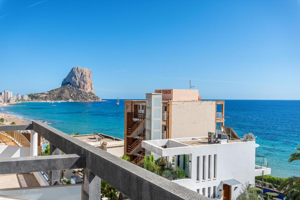 a view of the ocean from a building at Apartamento Melior 2C - PlusHolidays in Calpe