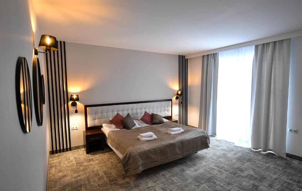 Posteľ alebo postele v izbe v ubytovaní Hotel Focus Centrum Konferencyjne