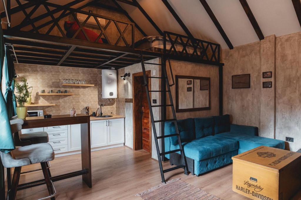a living room with a loft bed and a kitchen at PRESIDENT APARTMANI - Spa apartman, Fenix apartman, Galerija apartman in Šabac