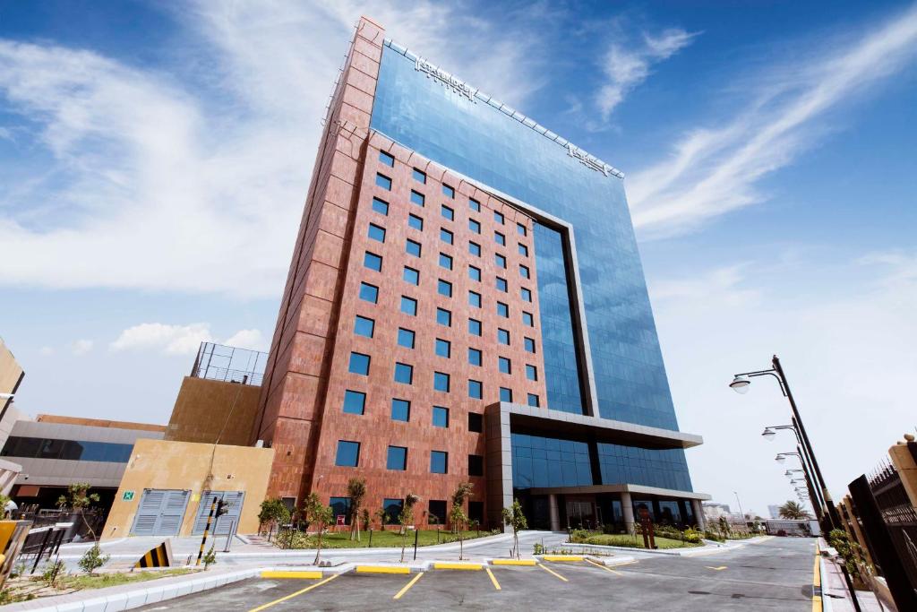 a tall building with a lot of windows at Al Andalus Mall Hotel in Jeddah