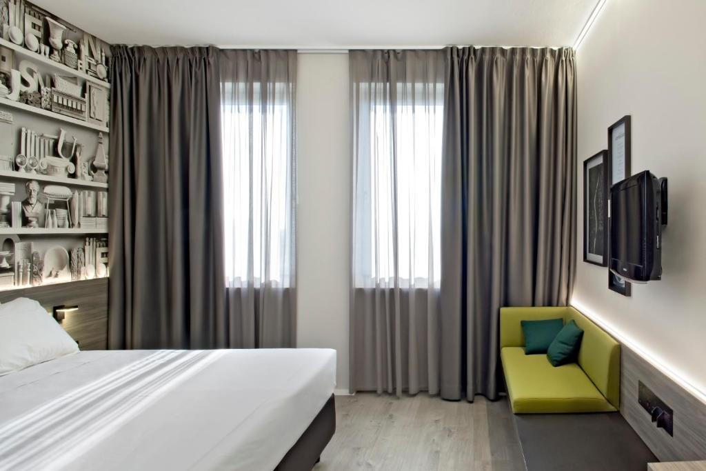 Postel nebo postele na pokoji v ubytování Hotel Friuli