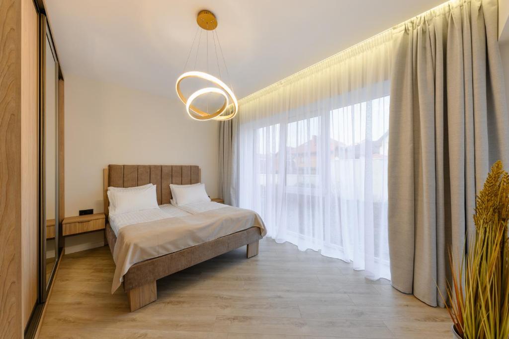Postel nebo postele na pokoji v ubytování MM GROUP APARTMENT GOLD