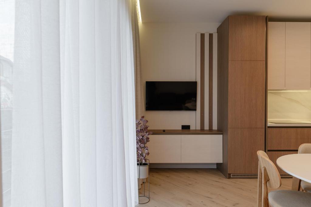 TV a/nebo společenská místnost v ubytování MM GROUP APARTMENT GOLD