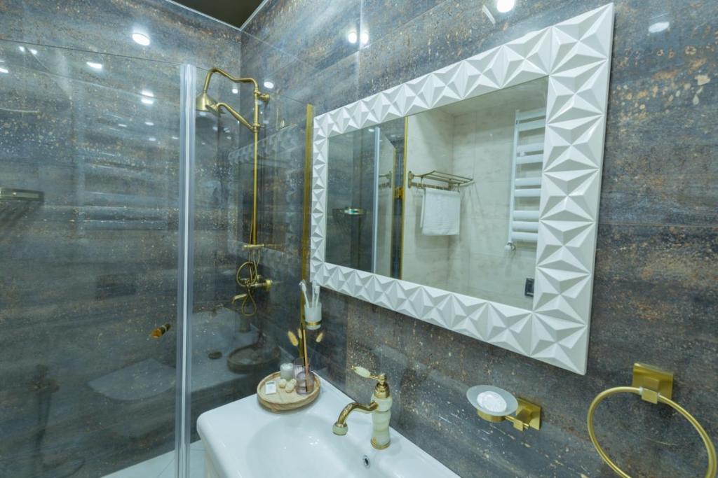 Koupelna v ubytování Marita Hotel