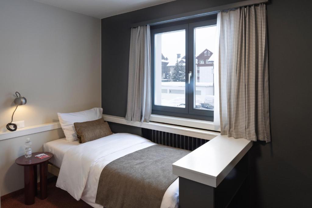 Postel nebo postele na pokoji v ubytování Hotel Bergidyll - Riders Haven