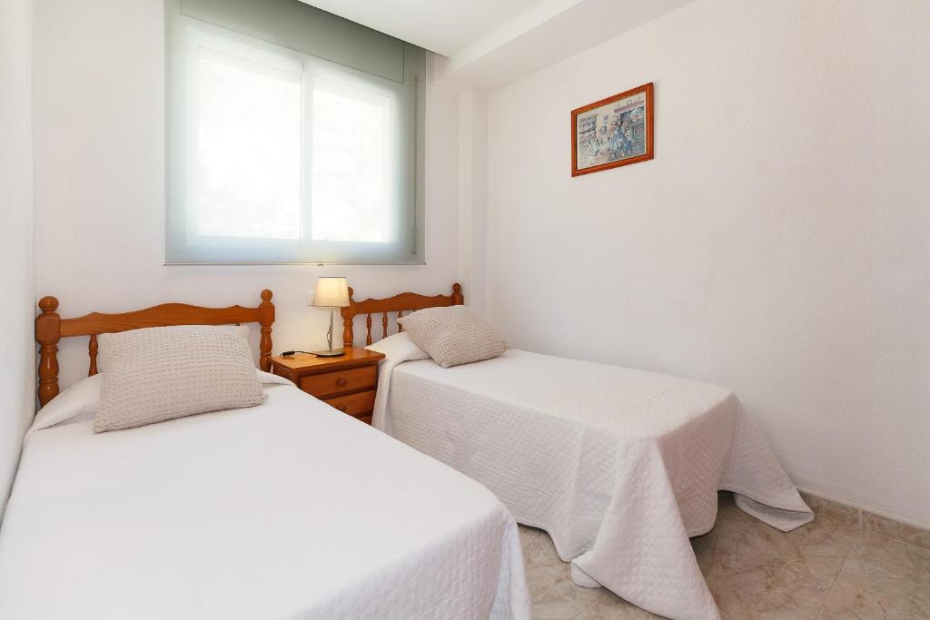 Postel nebo postele na pokoji v ubytování UHC Arco del Sol Family Complex
