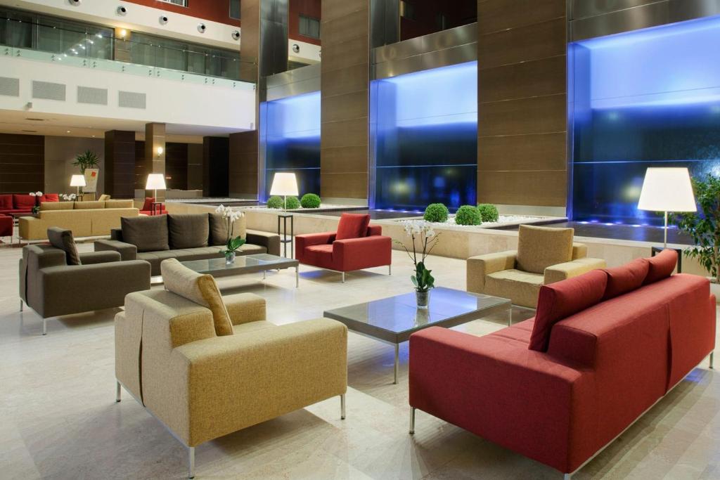 a lobby of a hotel with couches and chairs at Plaza Caserta in Caserta