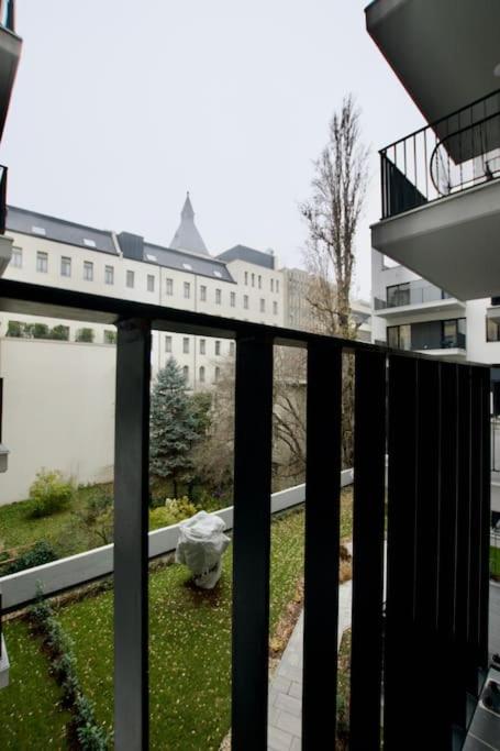 a balcony with a view of a building at Standard Apartment by Hi5-Horváth Mihály square in Budapest