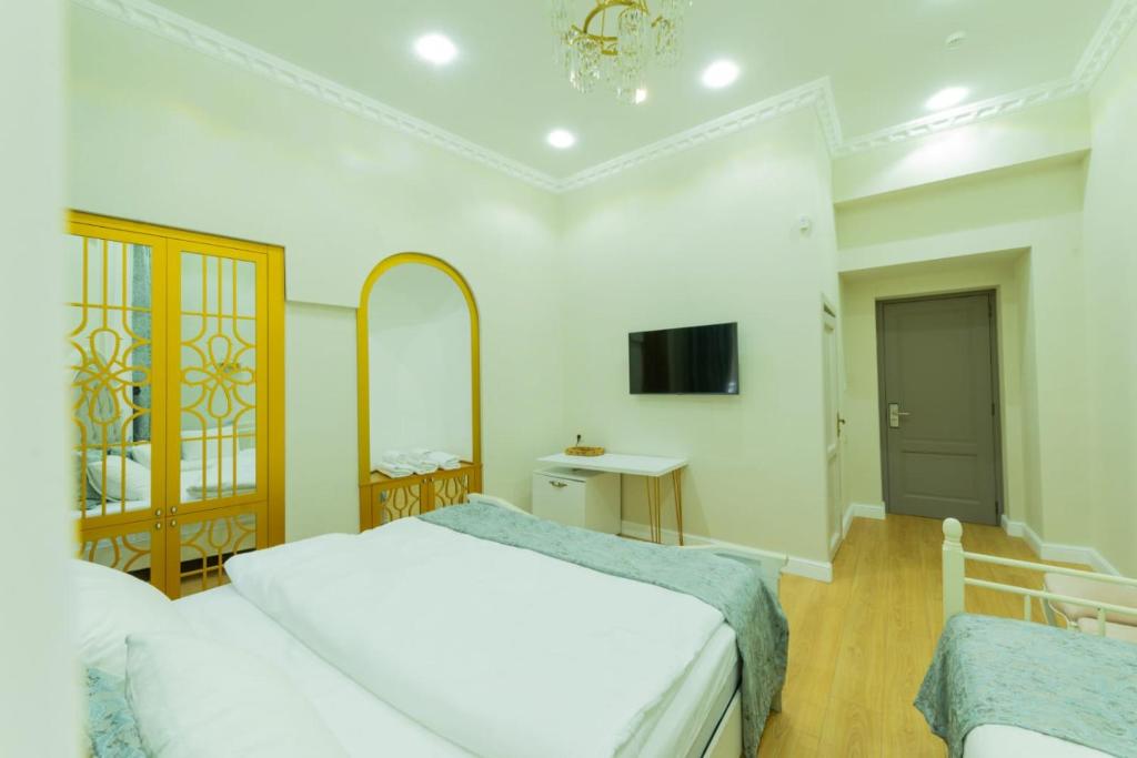 Postel nebo postele na pokoji v ubytování Marita Hotel