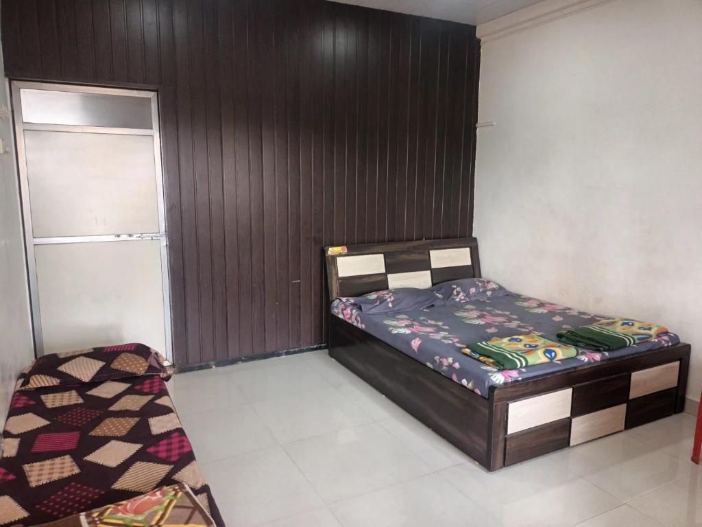 Postel nebo postele na pokoji v ubytování Hemprabha Bed & Breakfast, Ratnagiri