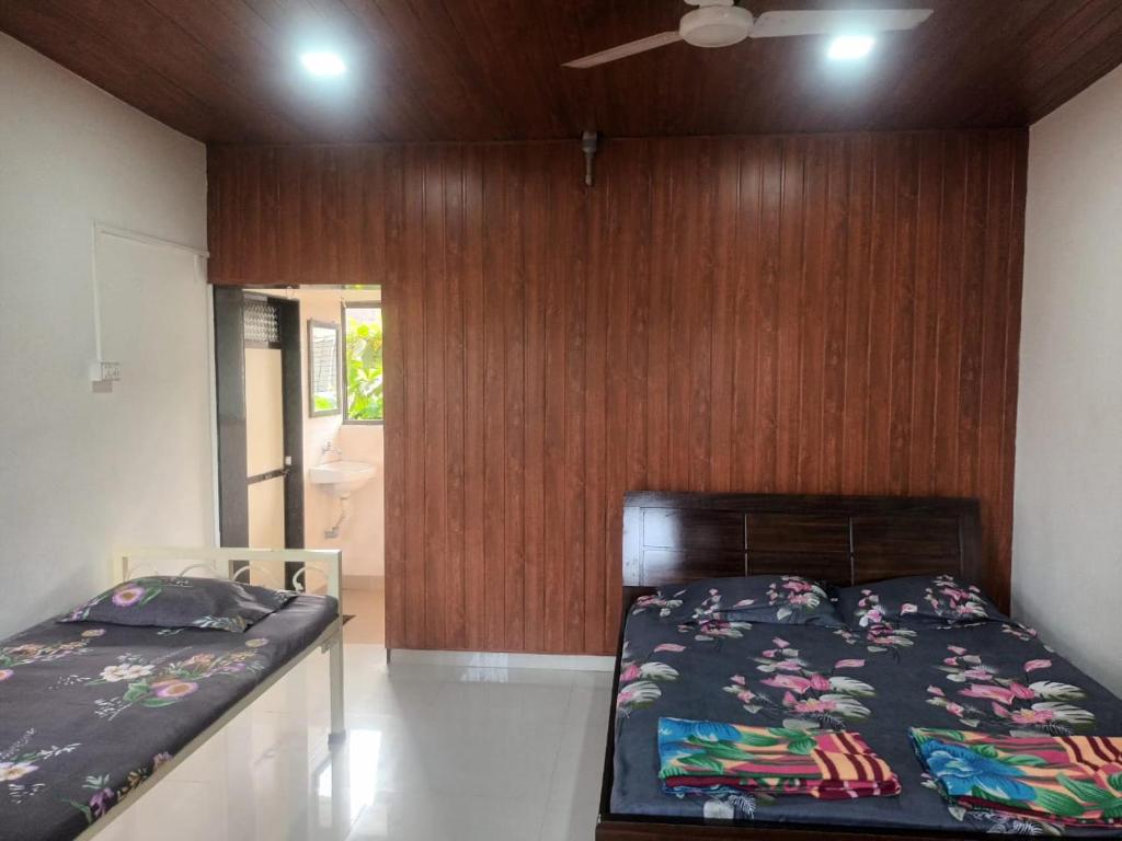 Postel nebo postele na pokoji v ubytování Hemprabha Bed & Breakfast, Ratnagiri