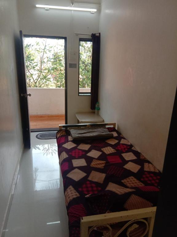 Postel nebo postele na pokoji v ubytování Hemprabha Bed & Breakfast, Ratnagiri