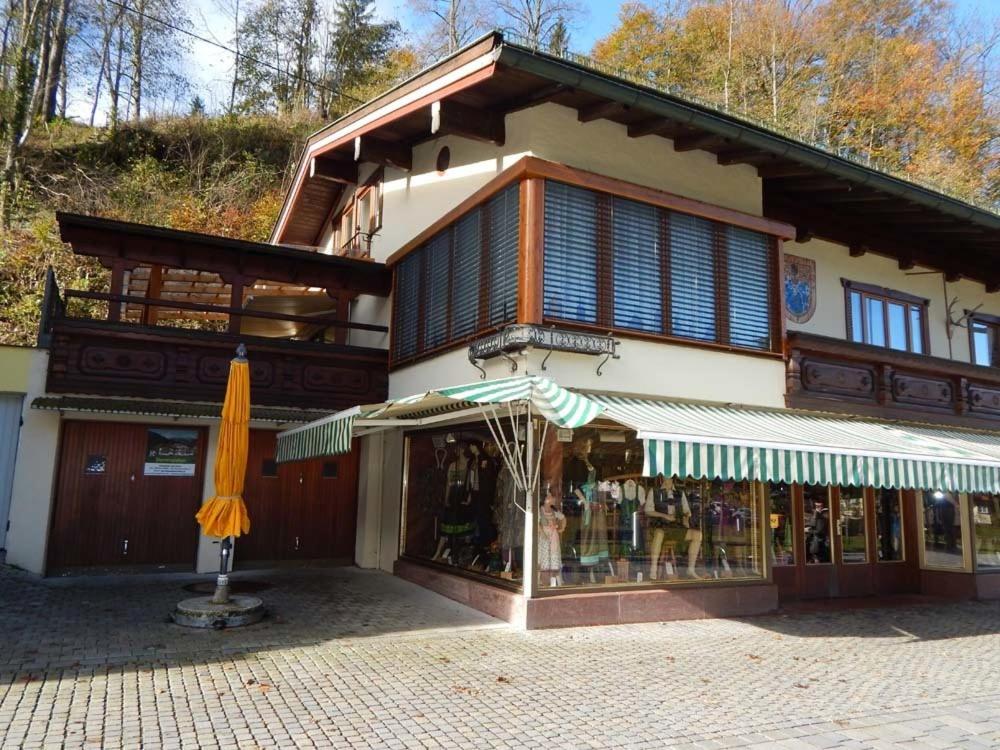 a store with an umbrella in front of a building at Haus Zeitz in Schönau am Königssee