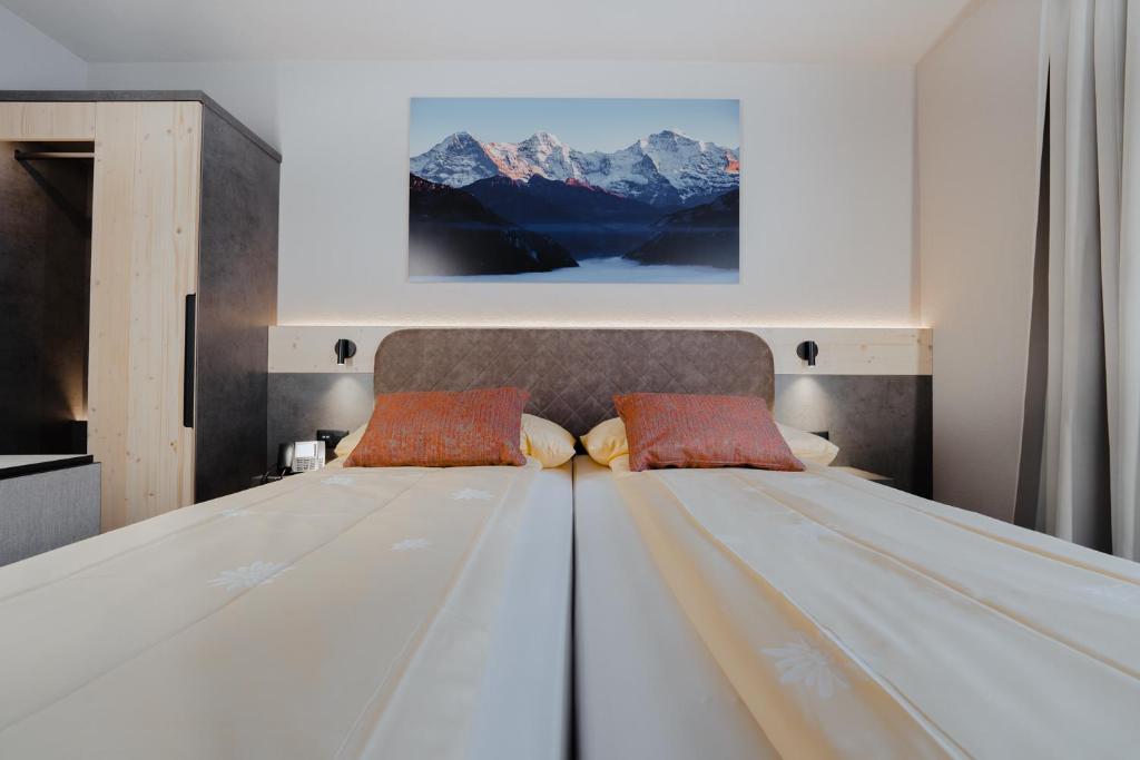 Cama o camas de una habitación en Hotel Central Wolter - Grindelwald