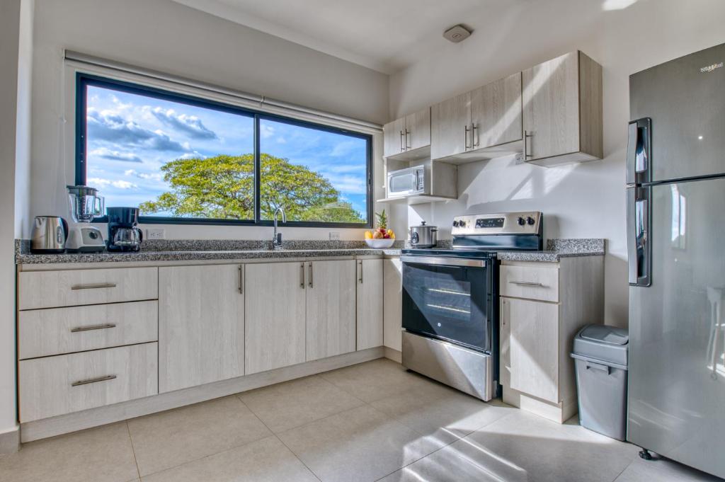 Kuchyň nebo kuchyňský kout v ubytování Muna Santa Rosa Apartamentos