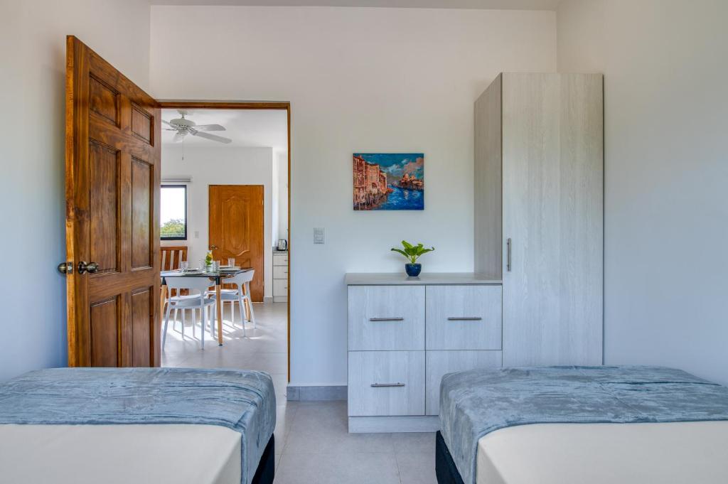Postel nebo postele na pokoji v ubytování Muna Santa Rosa Apartamentos