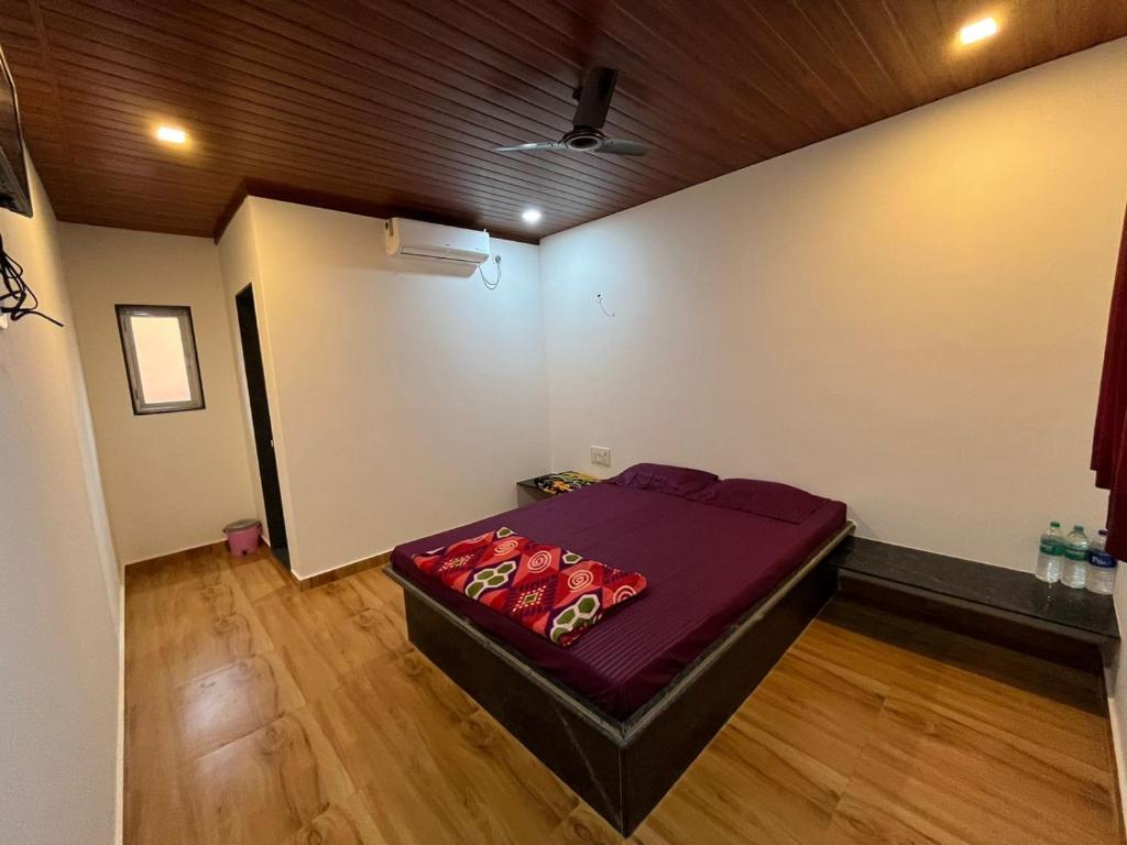 Postel nebo postele na pokoji v ubytování Hemprabha Bed & Breakfast, Ratnagiri