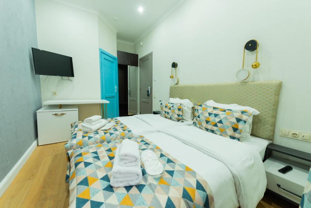 Postel nebo postele na pokoji v ubytování Marita Hotel
