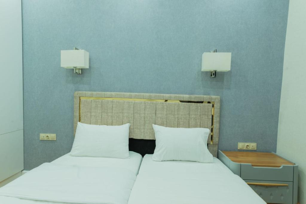 Postel nebo postele na pokoji v ubytování Marita Hotel