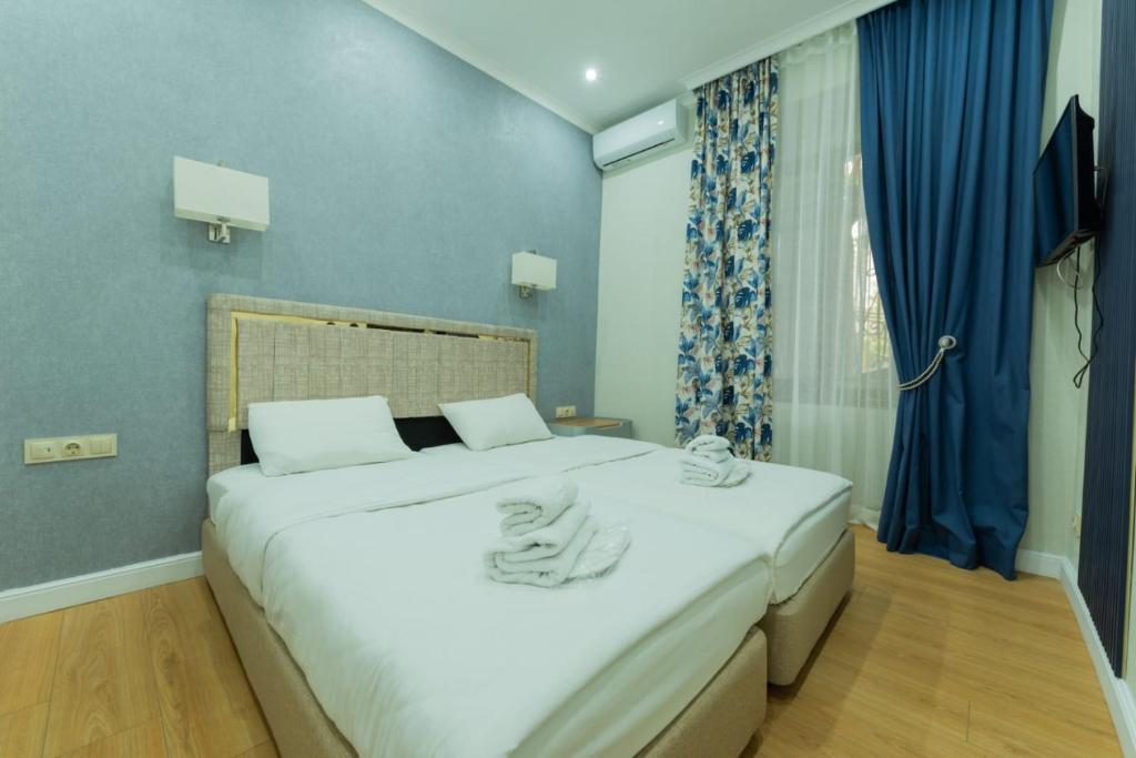 Postel nebo postele na pokoji v ubytování Marita Hotel