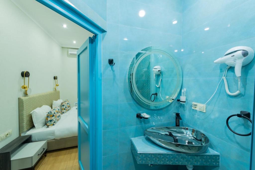 Koupelna v ubytování Marita Hotel