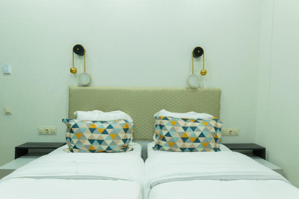 Postel nebo postele na pokoji v ubytování Marita Hotel