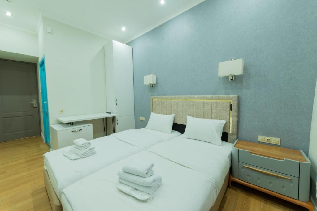 Postel nebo postele na pokoji v ubytování Marita Hotel